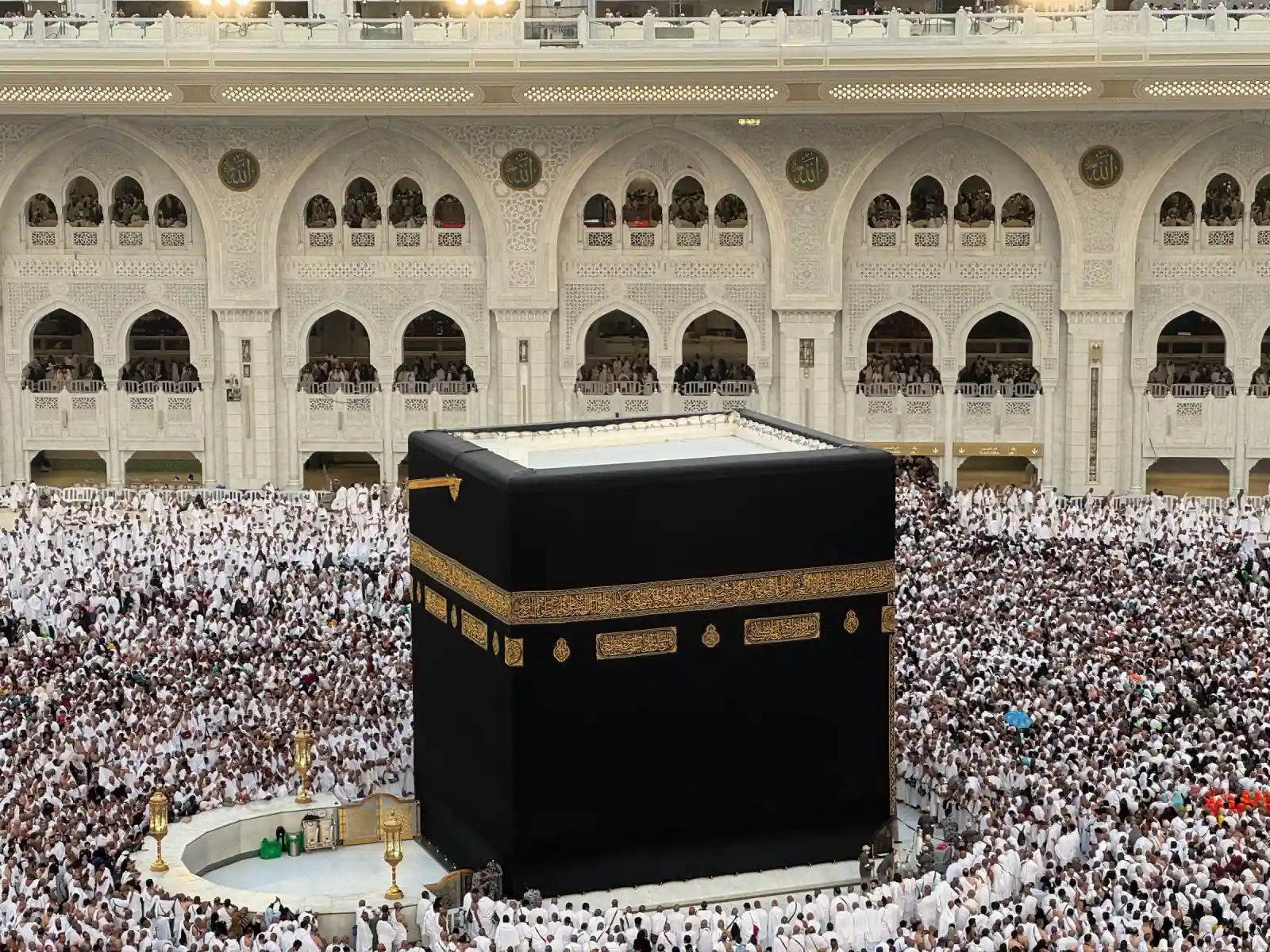 Aerial view of the Kaaba in Mecca surrounded by thousands of Hajj pilgrims in white Ihram during the Hajj season