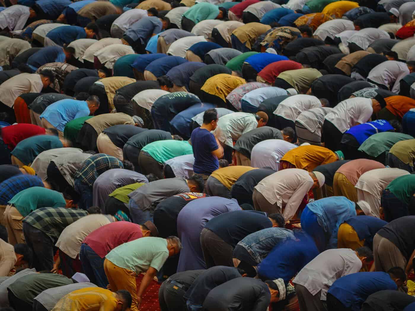 Large congregation of worshippers in ruku during Taraweeh night prayer, the special Ramadan prayer that intensifies in the last ten nights when Laylat al-Qadr is sought